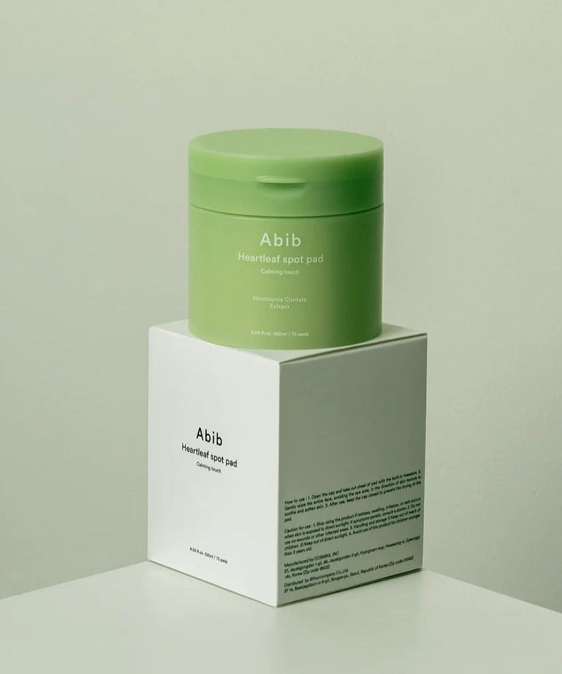 ABIB Heartleaf Spot Pad Calming Touch 70 pads packaging on display, showcasing skincare product design and branding.