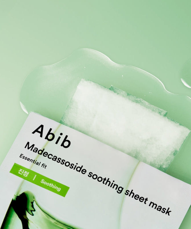 ABIB Madecassoside Soothing Sheet Essential Fit on a green background
