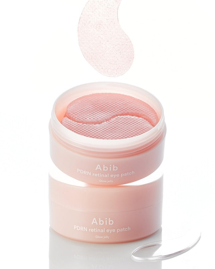 ABIB PDRN Retinol Eye Patch Glow jelly 30 Pairs showing patch lifted above container.