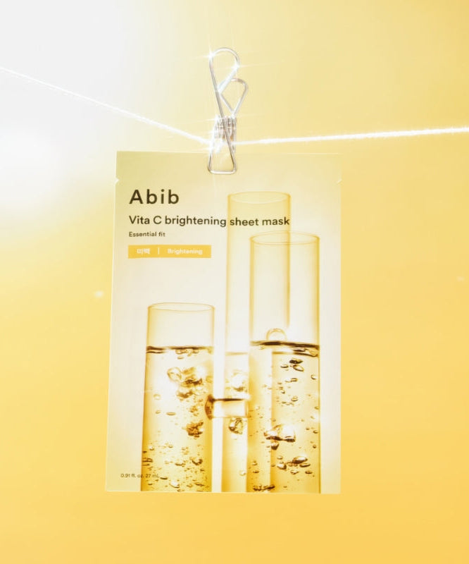 ABIB ABIB Madecassoside Soothing Sheet Essential Fit mask packaging on a yellow background.