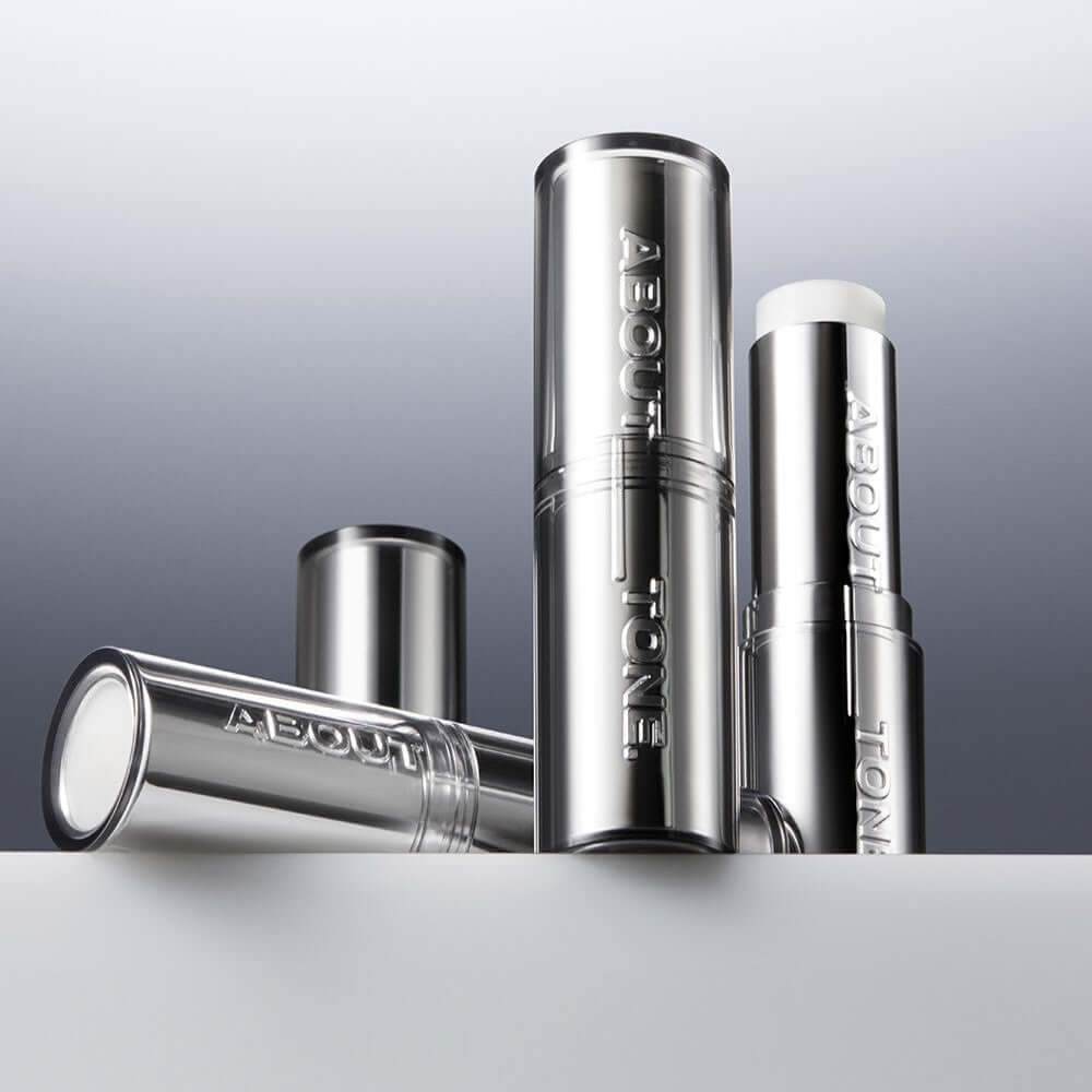 ABOUT TONE Blur Lasting Stick Primer in sleek silver packaging for a flawless finish.