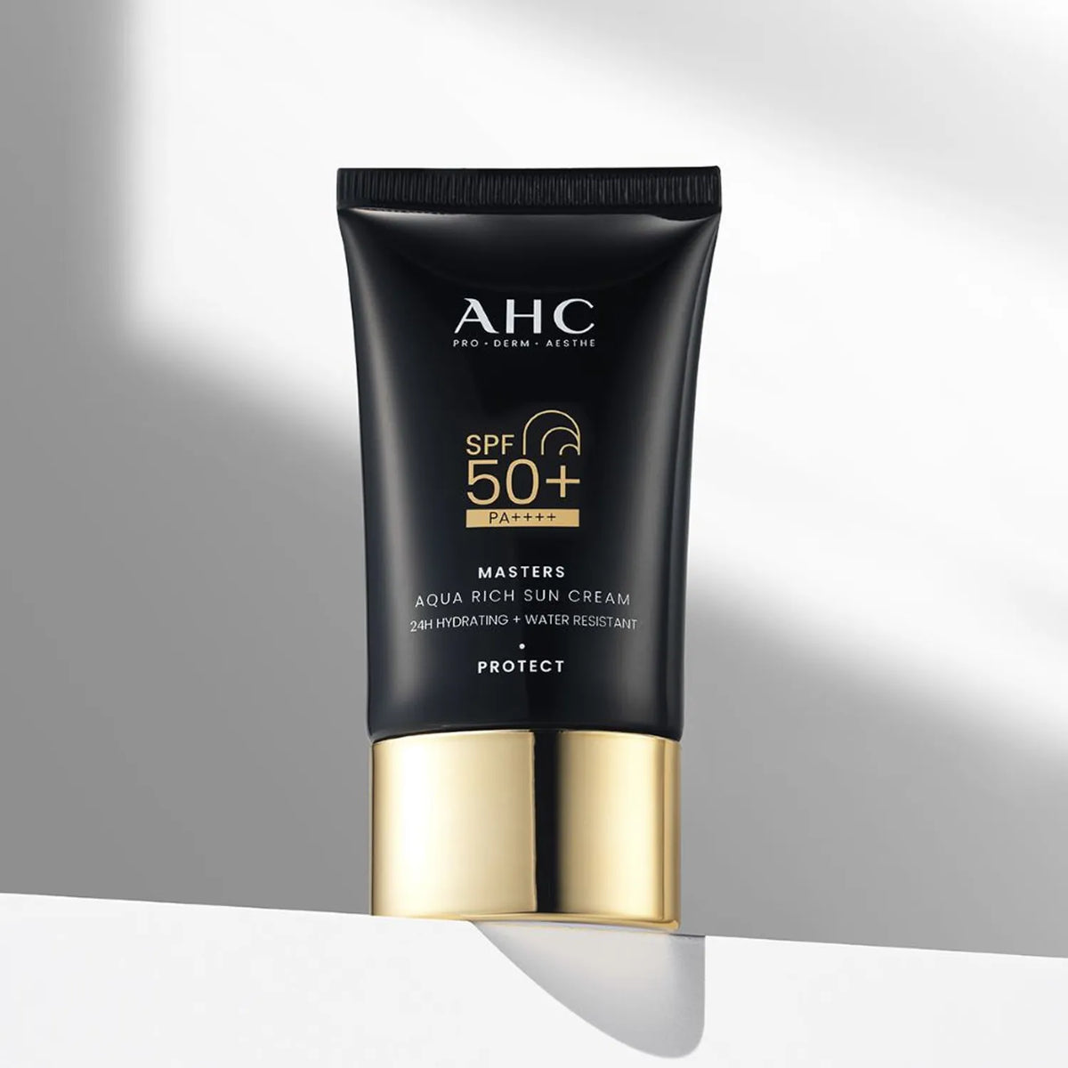 AHC Masters Aqua Rich Sunscreen 50ml with SPF 50+ in black and gold packaging.
