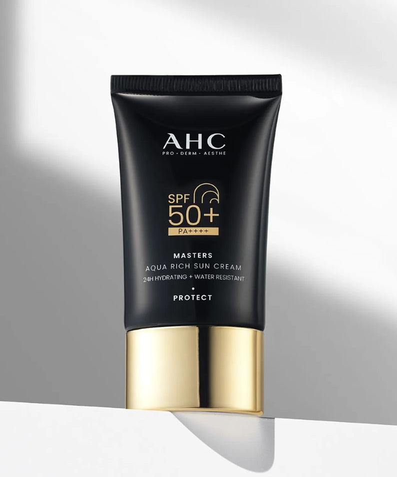 AHC Masters Aqua Rich Sunscreen 50ml with SPF 50+ in black and gold packaging.