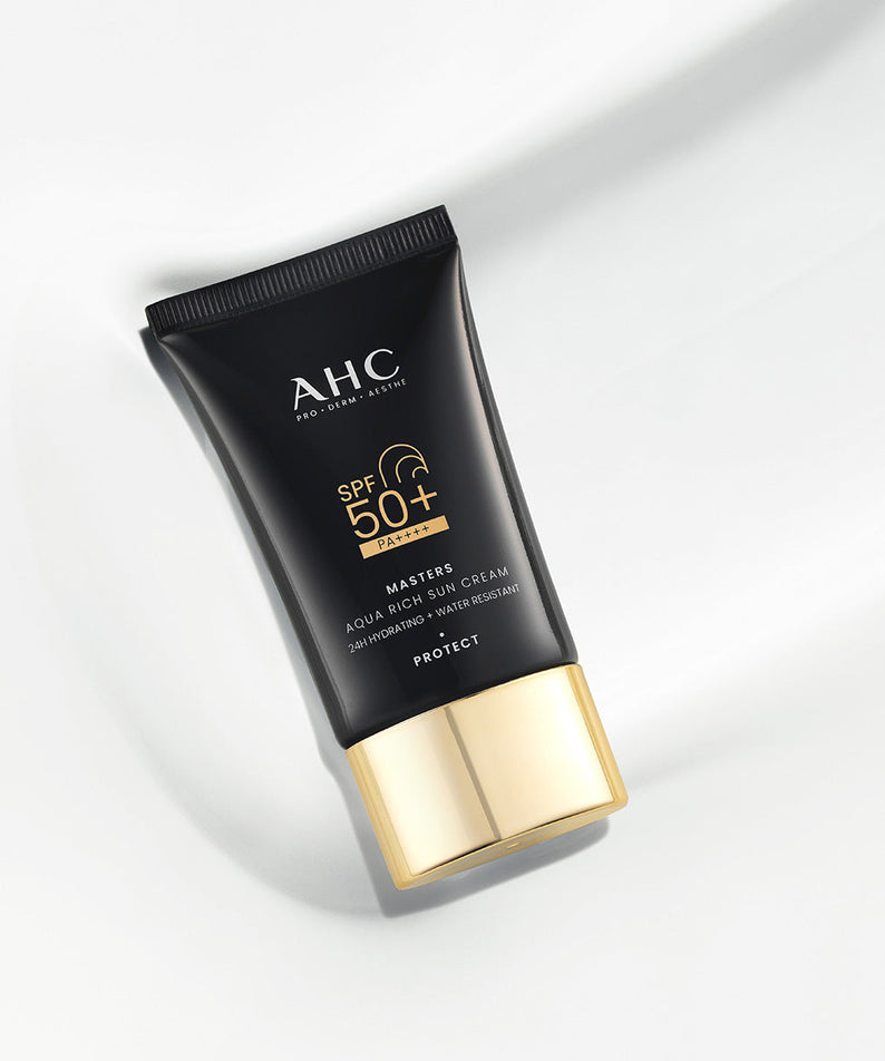 AHC Masters Aqua Rich Sunscreen 50ml tube on a white background showcasing its sleek design and SPF 50+ protection.