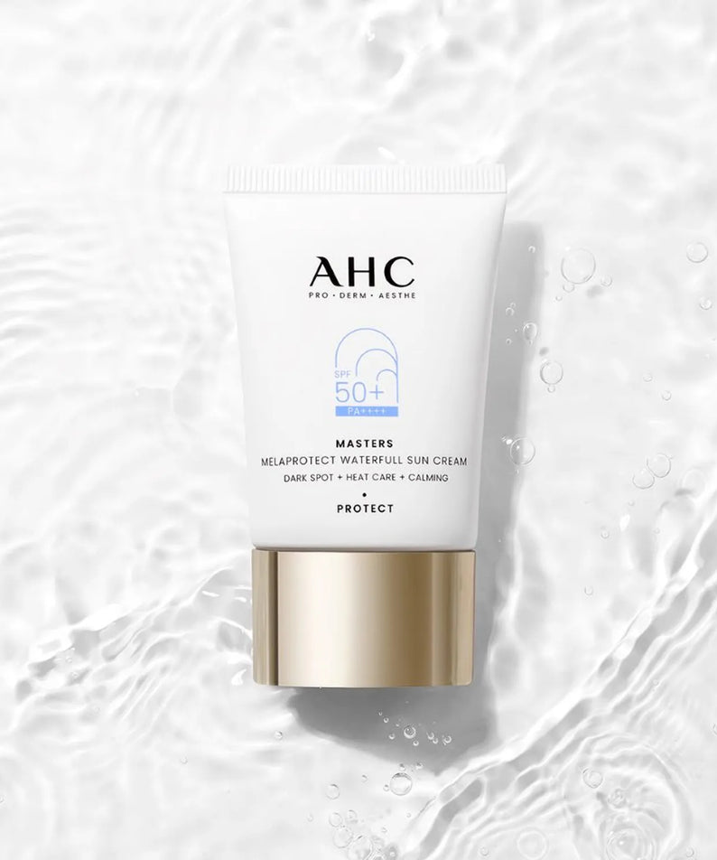 AHC Masters Mela Protect Waterfull Sunscreen 40ml tube on a watery background, emphasizing sun protection and skincare benefits.