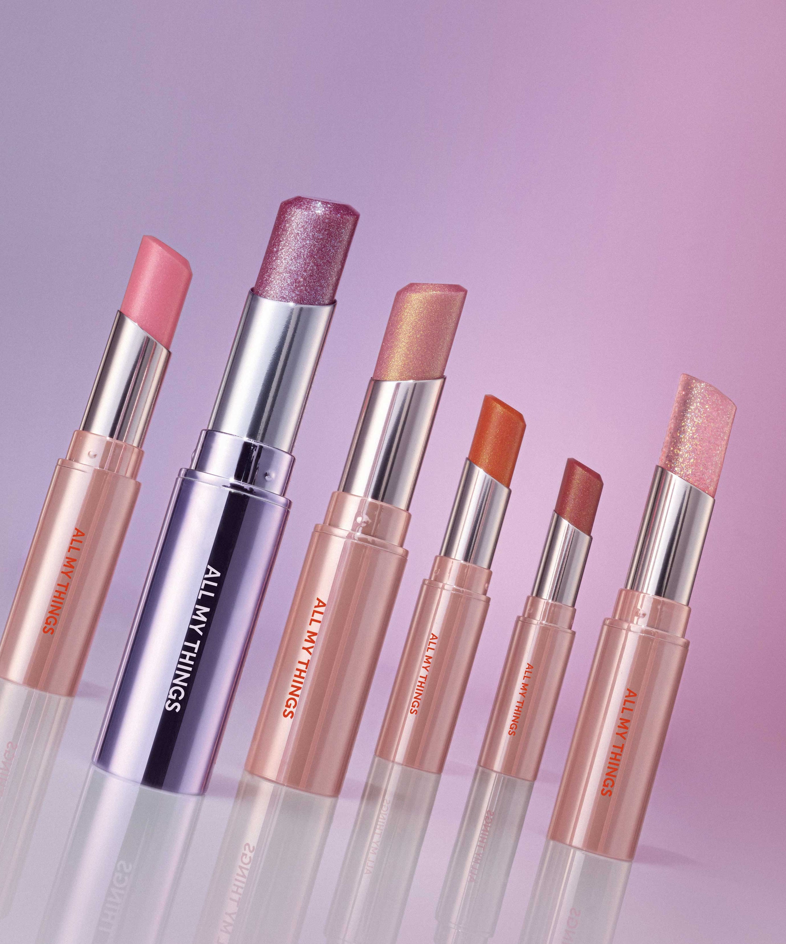 ALL MY THING I'm Your Lip Tint collection in various shades on a gradient background.