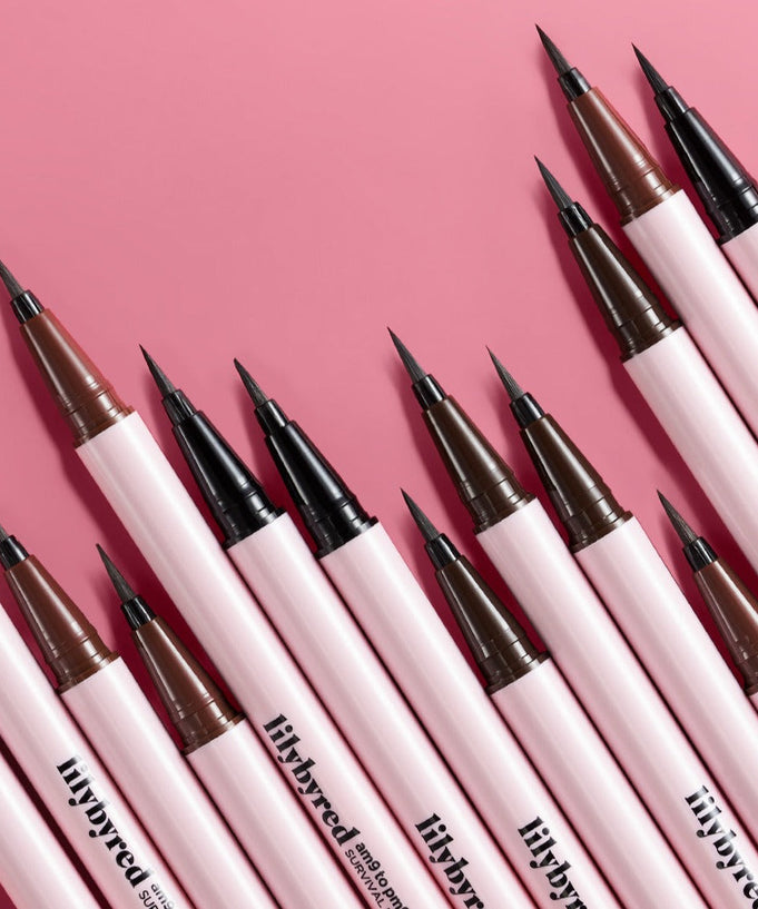 LILYBYRED am9 to pm9 Survival Penliner arranged on a pink background, showcasing precision tips in black and brown shades.