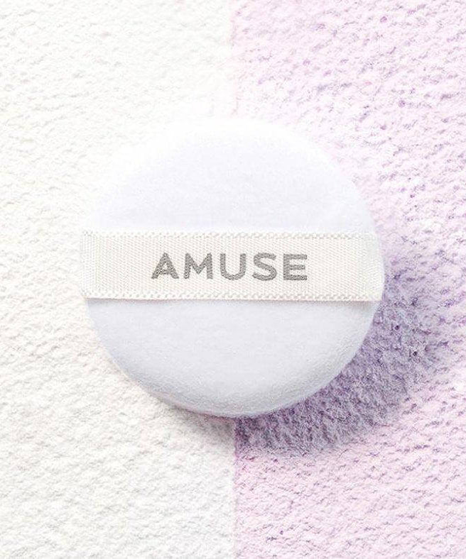AMUSE Ceramic Sebum Powder on a textured background with dual colors