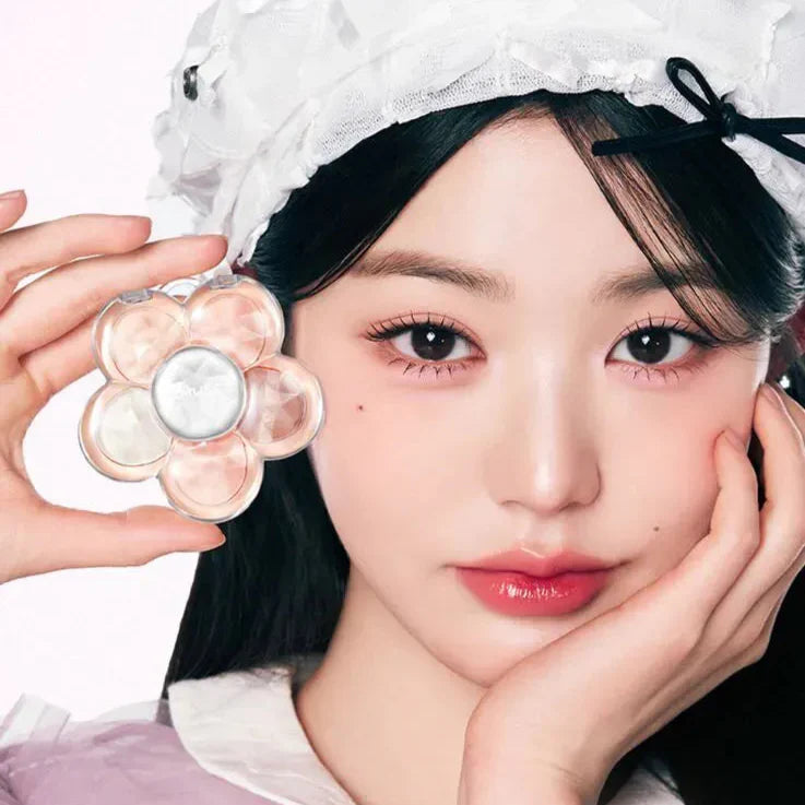 Model holding AMUSE Flora Eye Palette with floral design