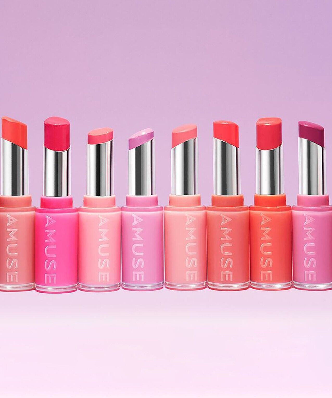 AMUSE Fondue Balm collection in vibrant shades on a pastel background
