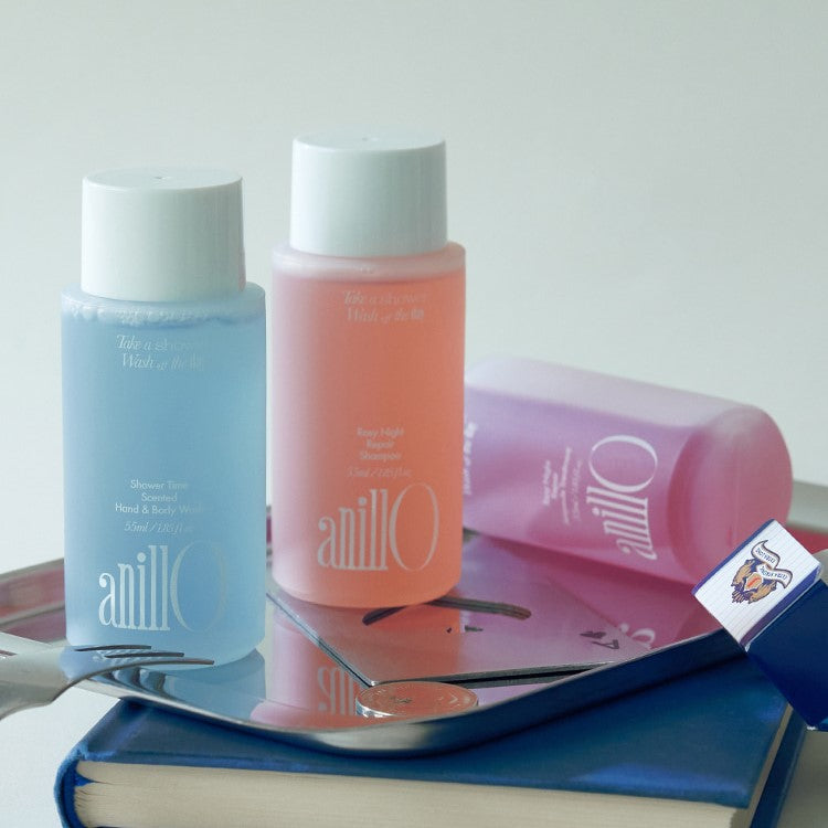 ANILLO Rosy Night & Shower Time Travel Shower Set (Shampoo 55ml, Ampoule Treatment 55ml & Hand And Body Wash 55ml) bottles on a tray