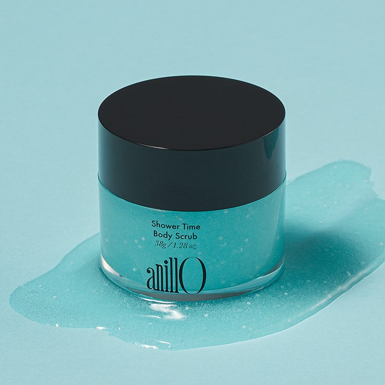 Image of ANILLO Shower Time Body Scrub 38g jar on blue background.
