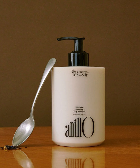 ANILLO Black Tea Nourishing Scalp Shampoo 450ml bottle with a spoon beside it.