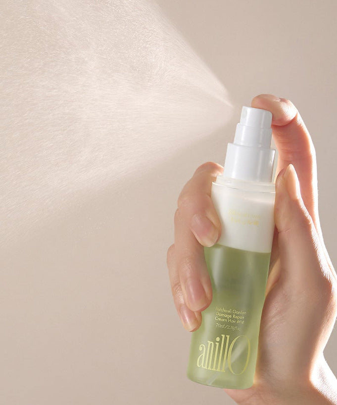 ANILLO Patchouli Garden Damage Repair Cream Hair Mist 70ml being sprayed
