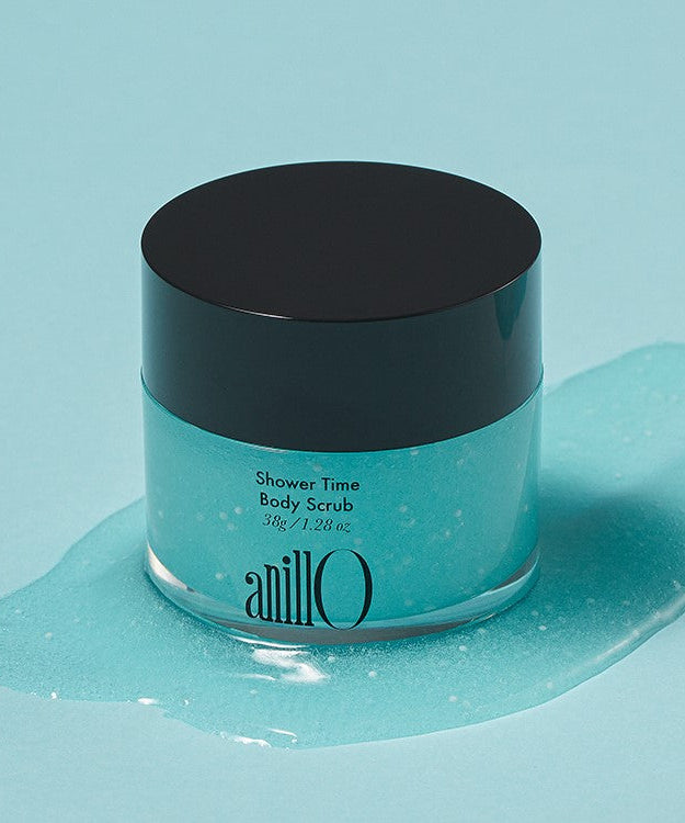 Image of ANILLO Shower Time Body Scrub 38g jar on blue background.