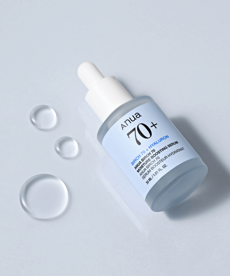 ANUA Birch 70 + Hyaluron Moisture Boosting Serum 30ml bottle with dropper on light blue background with droplets