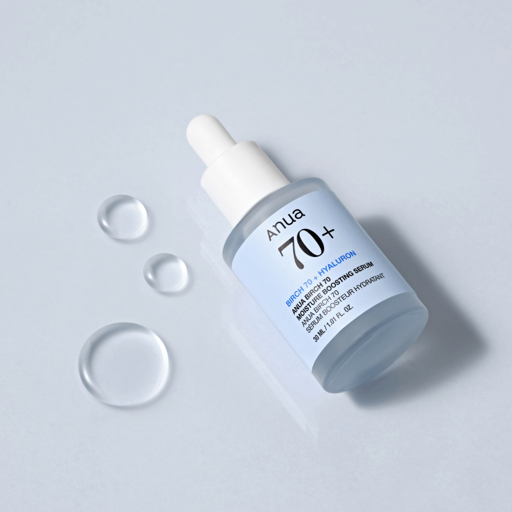 ANUA Birch 70 + Hyaluron Moisture Boosting Serum 30ml bottle with dropper on light blue background with droplets