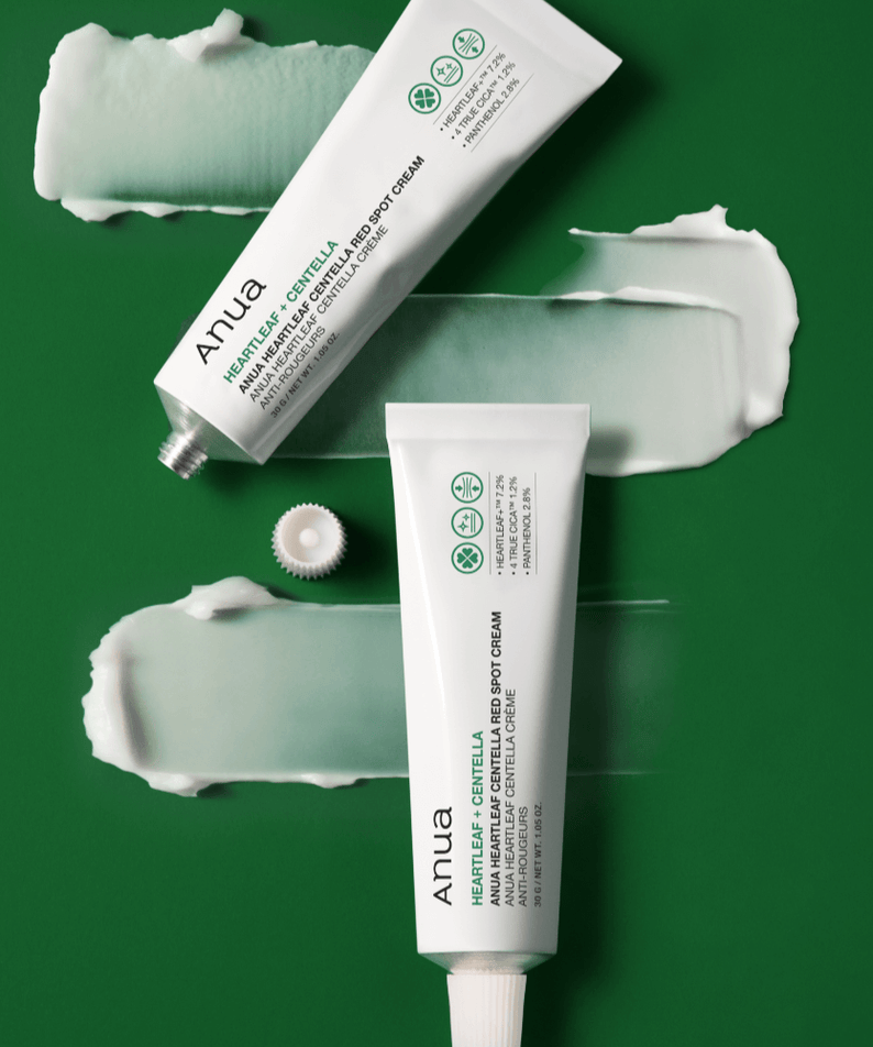 ANUA Centella Red Spot Cream with Asungcho on green background with cream texture