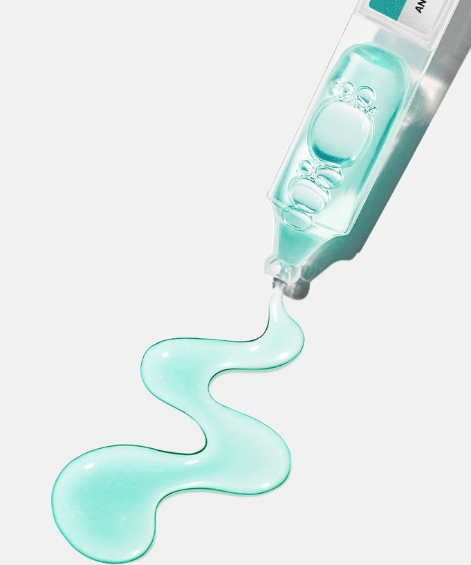 ANUA PDRN Hyaluronic Acid Capsule 100 Serum in a clear bottle with liquid flowing out, highlighting its hydrating properties.