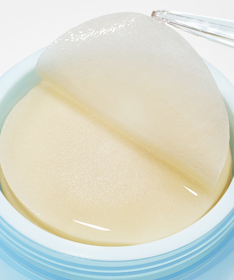 Image of ANUA 8 Hyaluronic Acid Catechin Calming Pads 110 Pads in a jar with a pair of tweezers lifting a pad.