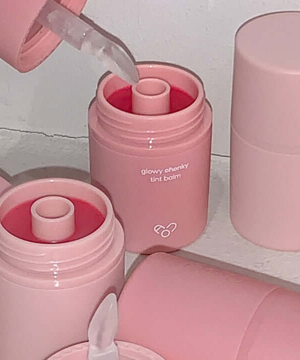 AOU Glowy Chonky Tint Balm containers showcasing the product's vibrant color and packaging.