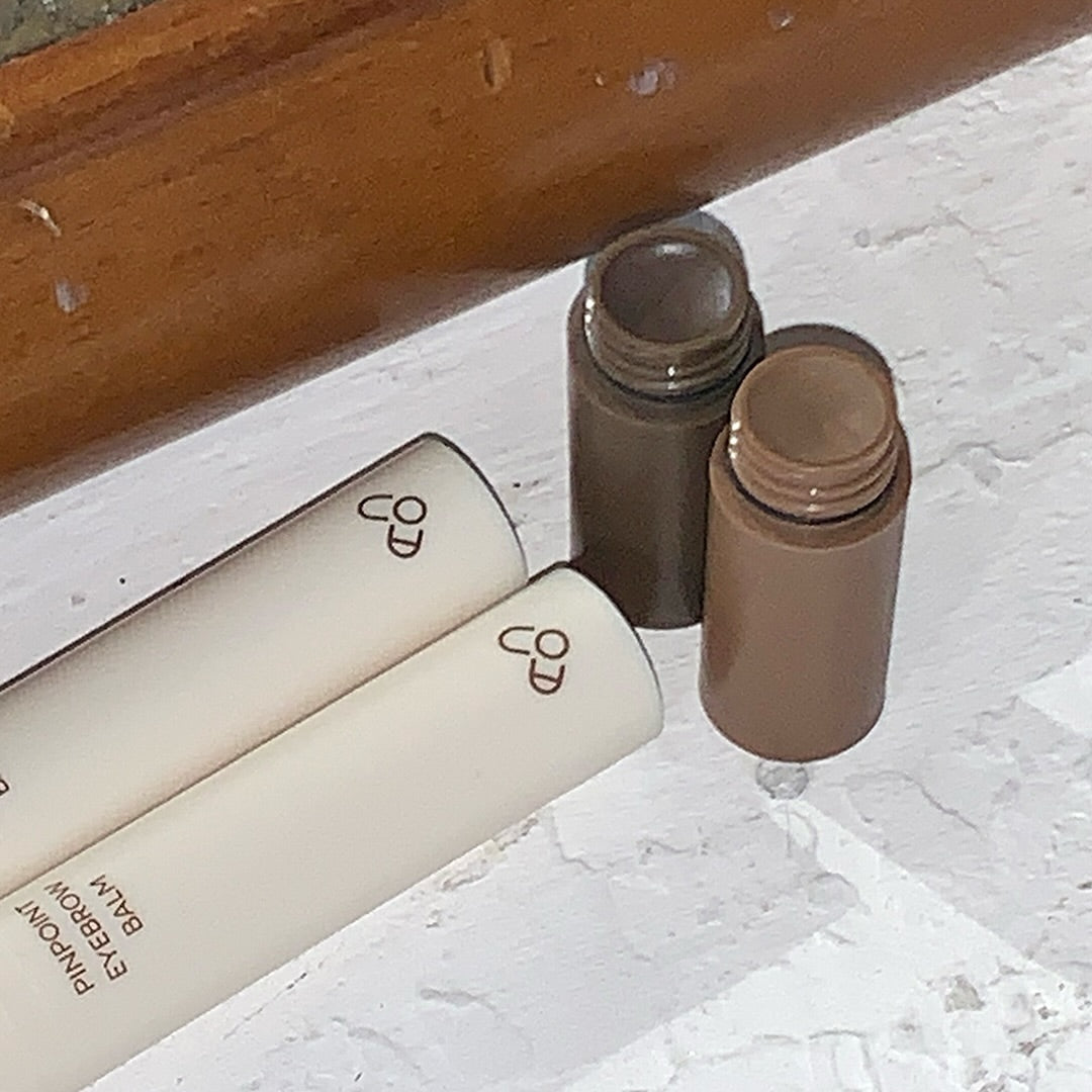AOU Pinpoint Eyebrow Balm displayed on a white surface