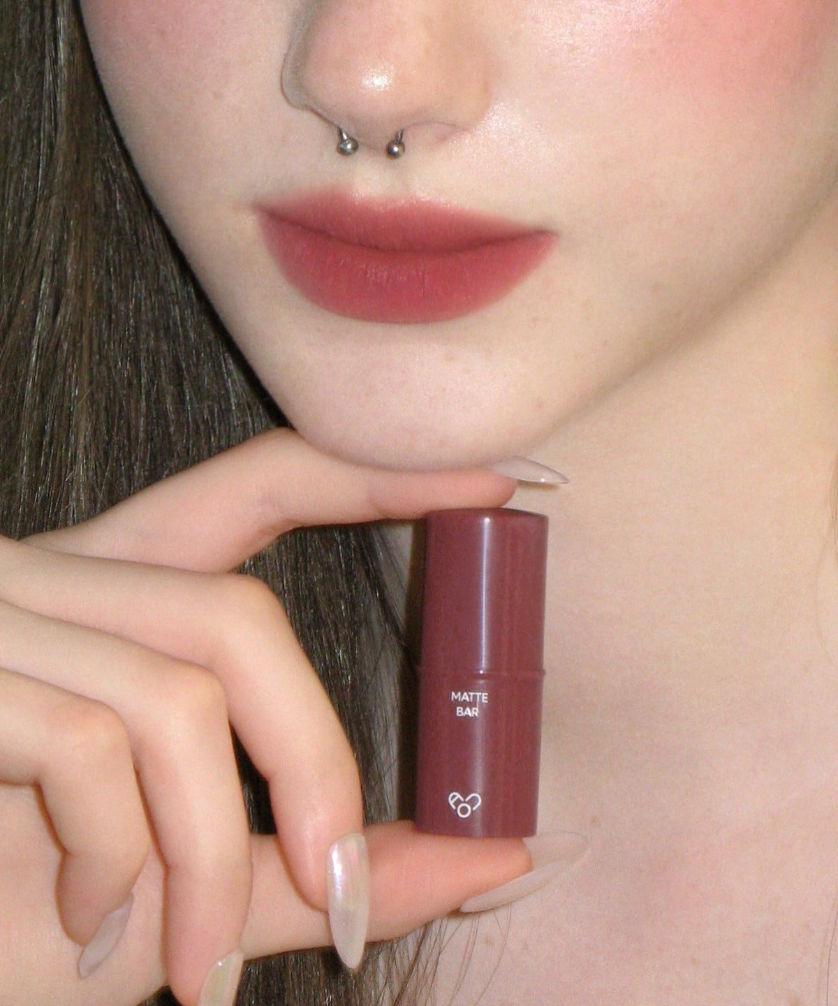 Close-up of a woman's lips wearing AOU Matte Bar lipstick, showcasing its smooth, matte finish.