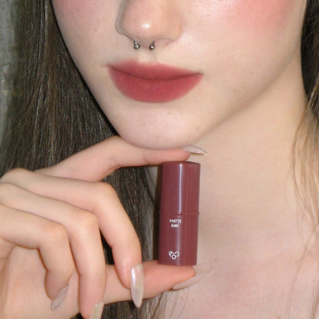 Close-up of a woman's lips wearing AOU Matte Bar lipstick, showcasing its smooth, matte finish.