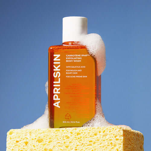 APRILSKIN Carrotene IPMP Exfoliating Body Wash with foam and sponge, 300ml bottle