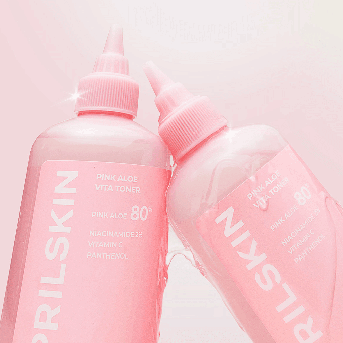 APRILSKIN Pink Aloe Vita Toner product bottles with vibrant pink packaging, showcasing skincare ingredients like Niacinamide and Vitamin C.