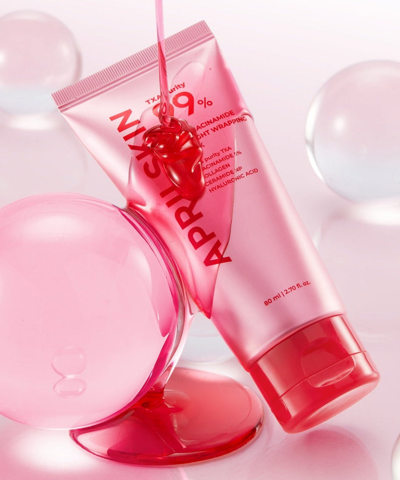 APRILSKIN TXA Niacinamide 99 Deep Cleanser 120g in a dynamic pink package with globules in background.