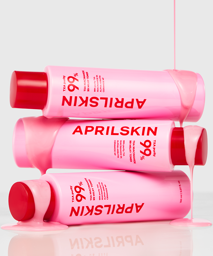 APRILSKIN TXA Niacinamide 99 Milky Toner 150ml bottles with pink liquid flowing over them