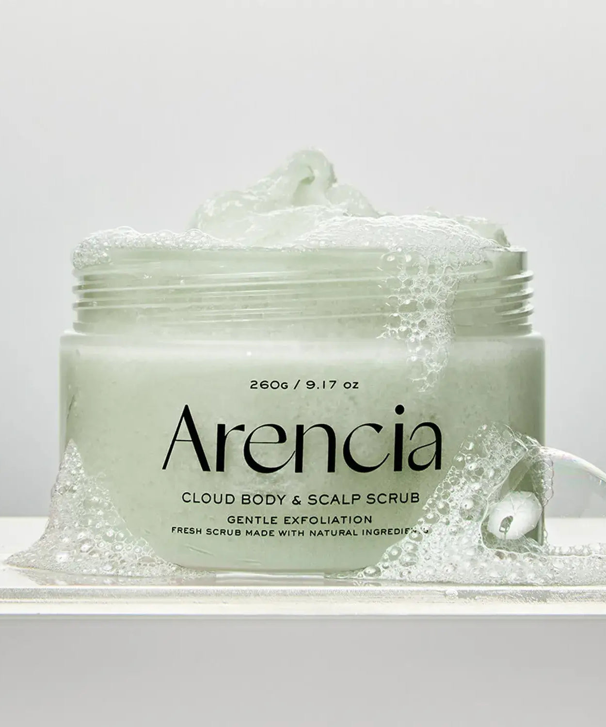 ARENCIA Fresh Cloud Body Scrub 260g jar with gentle exfoliation soap bubbles, showcasing premium skincare product for radiant skin