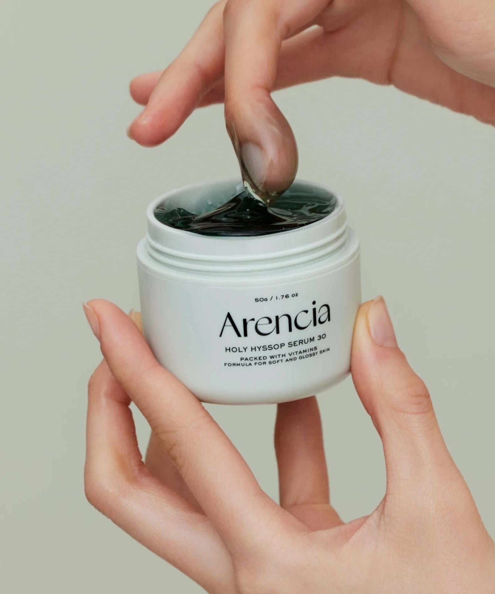 ARENCIA Fresh Holly Hyssop Serum 30 50g in hand, showing gel texture and product label.
