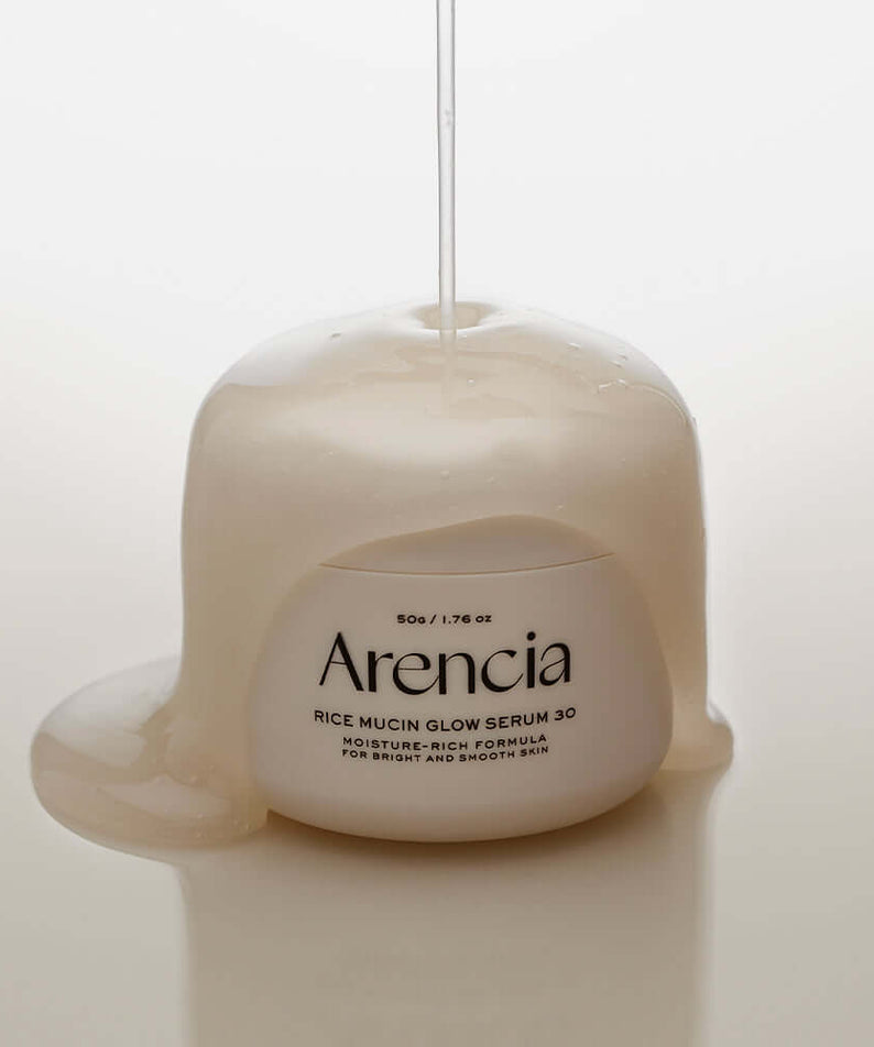 ARENCIA Rice Mucin Glow Serum 50g showcased with light serum texture for hydration and glow on skin.