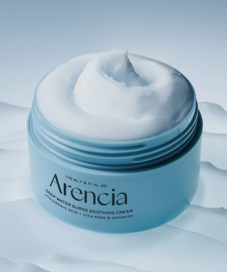 ARENCIA Deep Water Surge Soothing Cream 80ml in an open jar on a textured surface