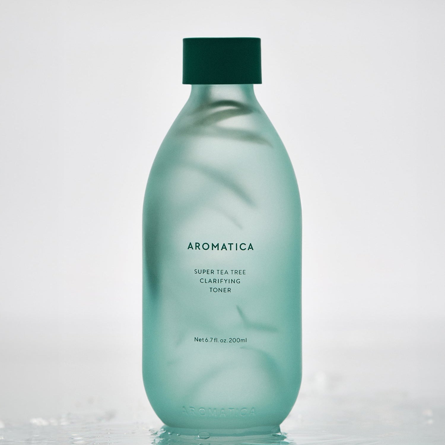 AROMATICA Super Tea Tree Clarifying Toner 200ML in a frosted green bottle on a light background.