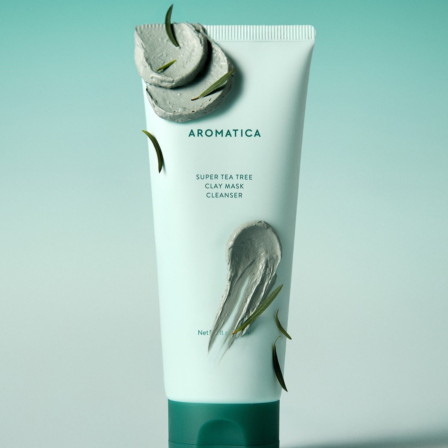AROMATICA Super Tea Tree Clay Mask Cleanser 150ML tube with clay texture and green leaves on a gradient background