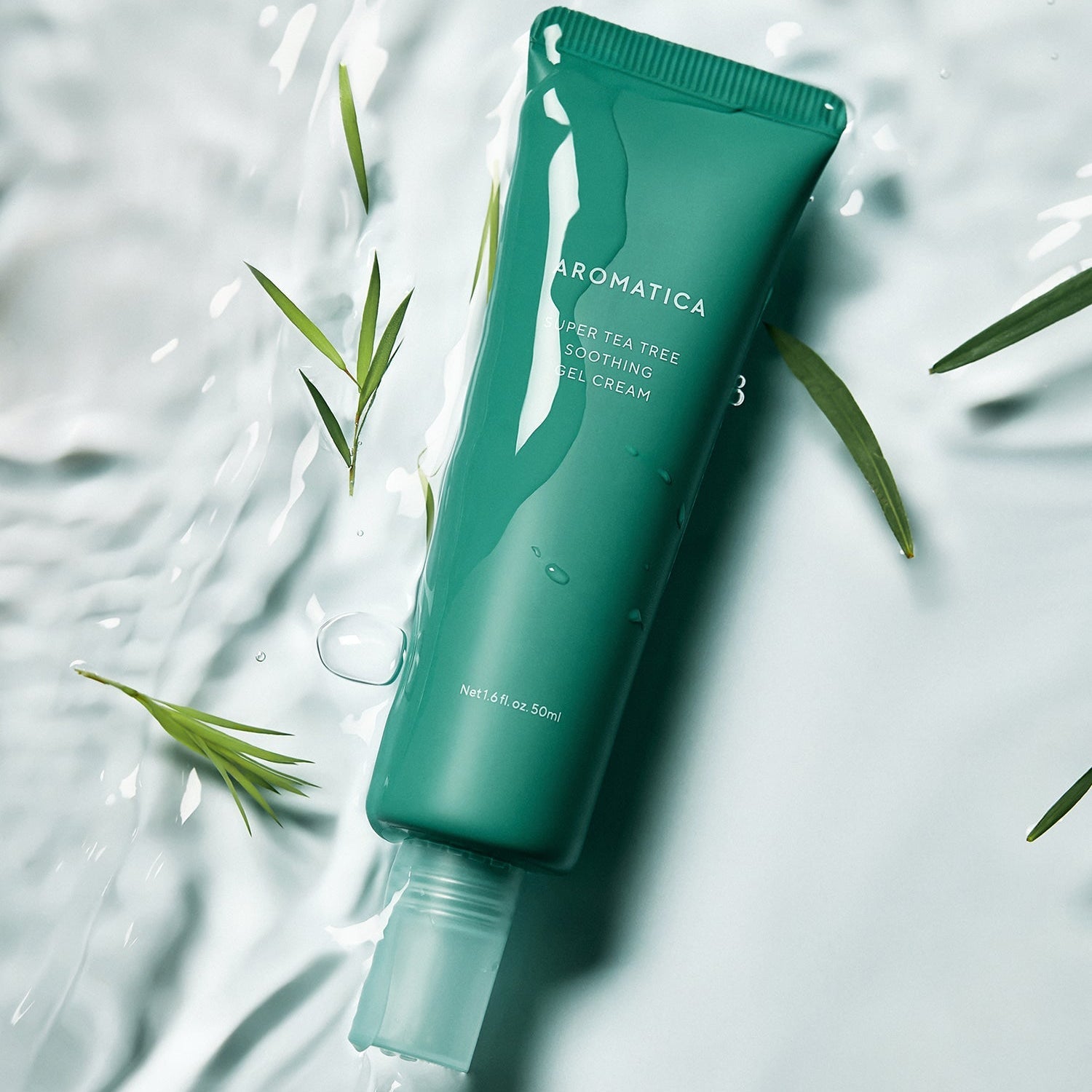 AROMATICA Super Tea Tree Soothing Gel Cream 50ML tube with green leaves on wet surface
