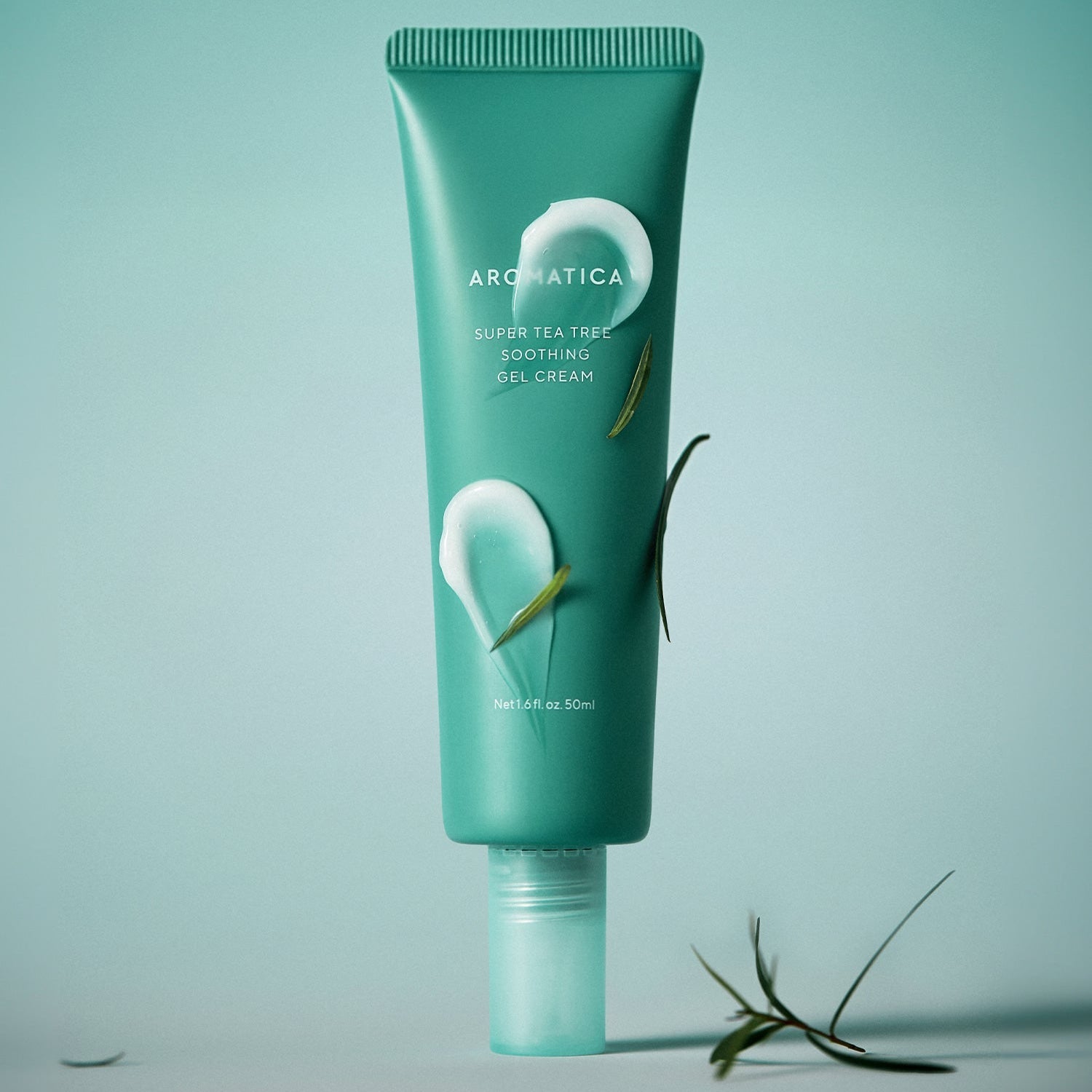 AROMATICA Super Tea Tree Soothing Gel Cream 50ML in green tube with tea tree leaves on green background