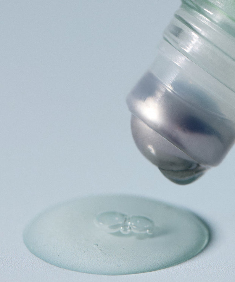 Close-up of AROMATICA Rosemary Root Volumizing Scalp Ampoule 20ML applicator dispensing product.