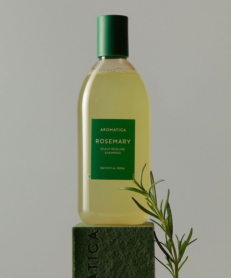 AROMATICA Rosemary Scalp Scaling Shampoo 750ML bottle with rosemary sprig on a studio background.