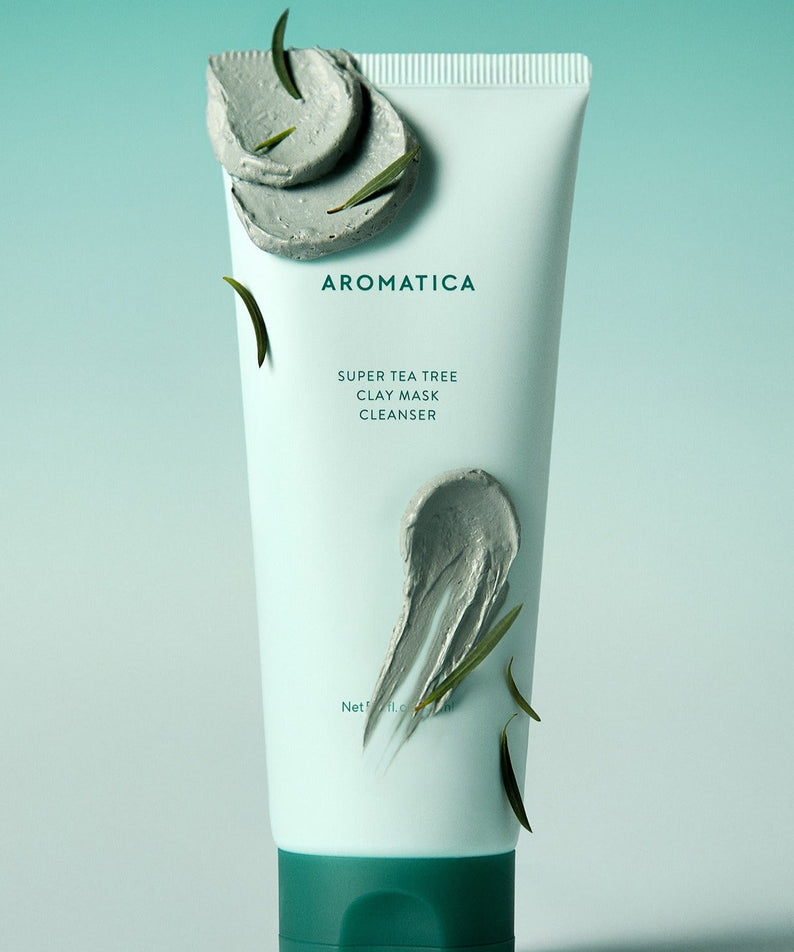 AROMATICA Super Tea Tree Clay Mask Cleanser 150ML tube with clay texture and green leaves on a gradient background