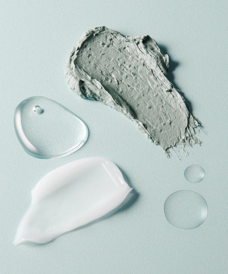 Textures of the AROMATICA Super Tea Tree Clay Mask Cleanser 150ML showing clay and liquid elements on a pastel background