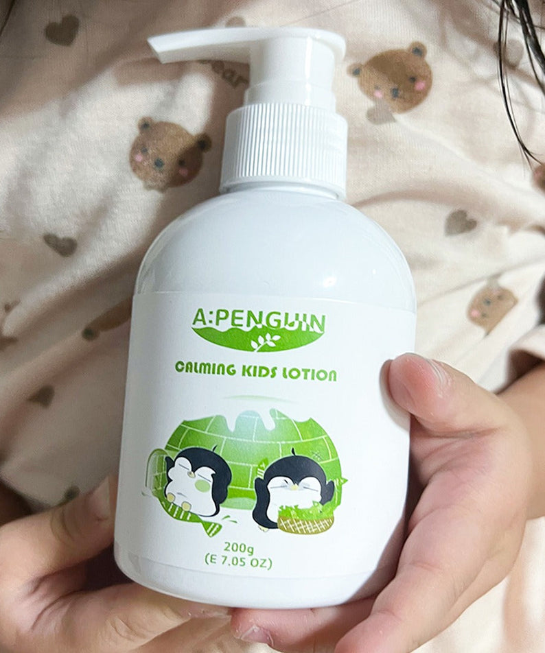 ATOMANDE Arctic Penguin Kids Children Calming Lotion Skin Soothing Moisturizing Body 200ml bottle held in child's hands