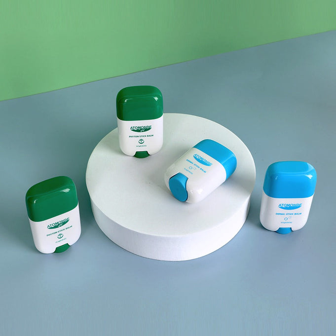ATOMANDE Phyton Stick Balm 16.5g 1ea shown on display against a green background