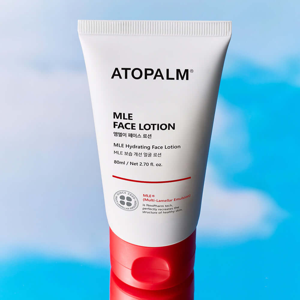ATOPALM Face Lotion 80ml tube against sky background.
