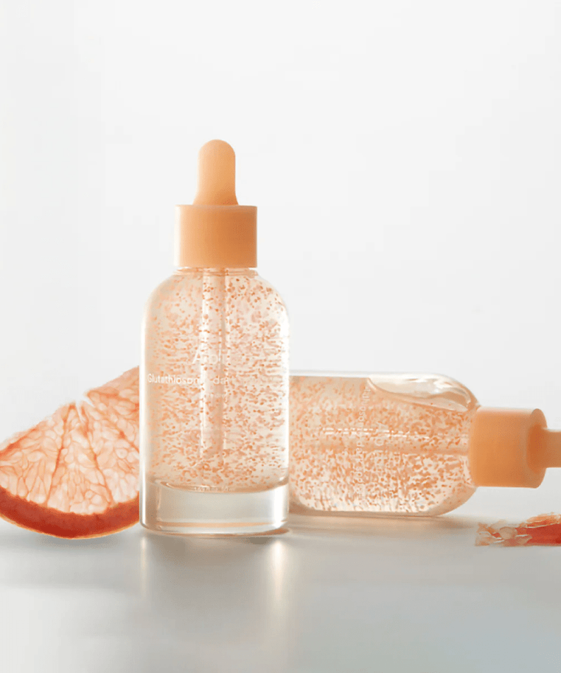 ABIB Glutathiosome Spot Serum Vita Drops 50ml with citrus slice on clean background