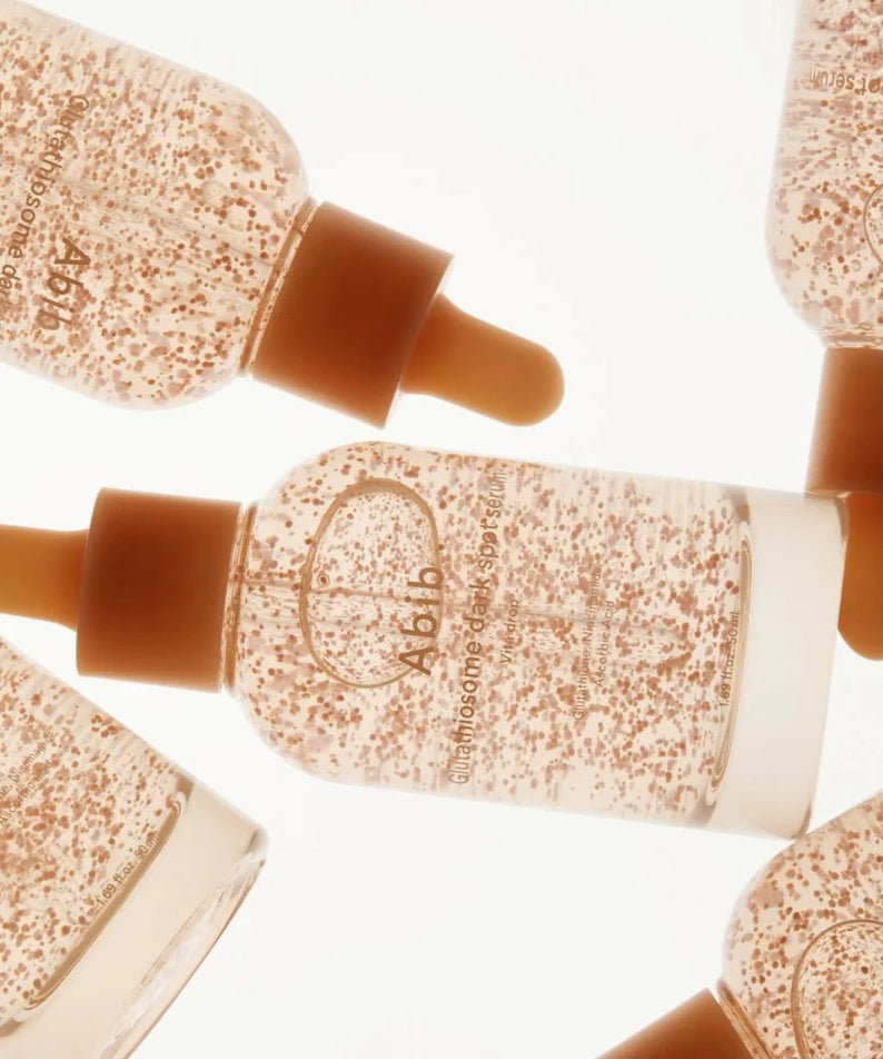 ABIB Glutathiosome Spot Serum Vita Drops 50ml product image with multiple serum bottles displayed.