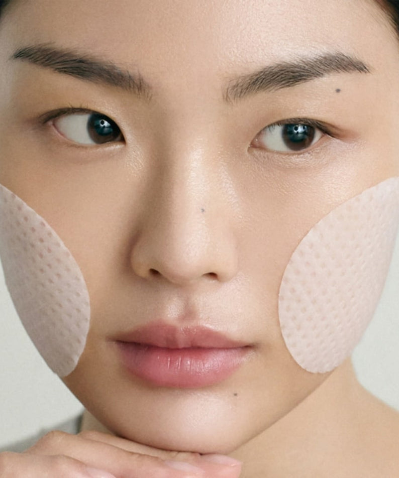 Close-up of woman using ABIB Jericho Rose Collagen Pad Firming Touch 60 Pads for skincare